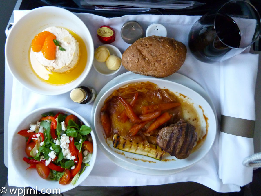 LAN Peru Premium Economy Airline Meal: Grilled Steak with Roasted Vegetables, Hummus, and Fresh Salad